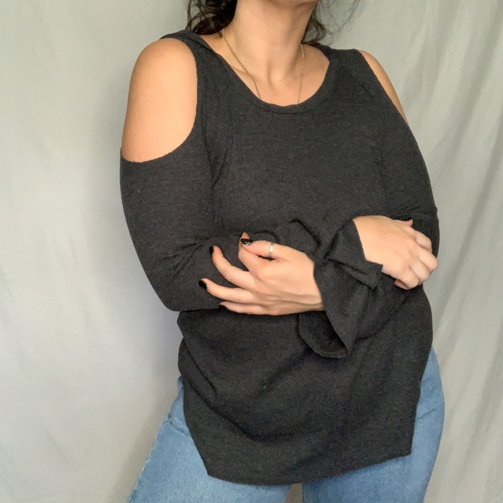 Sweater with hood and shoulder cut out